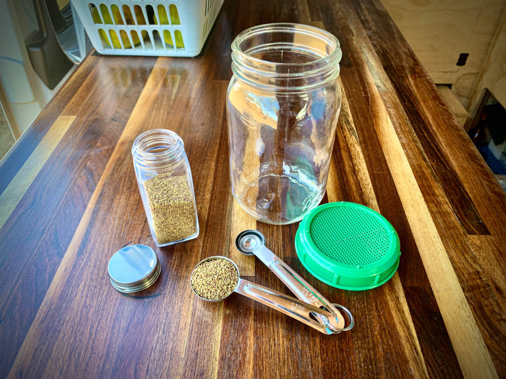 alfalfa sprout seeds and mason jar with screened lid